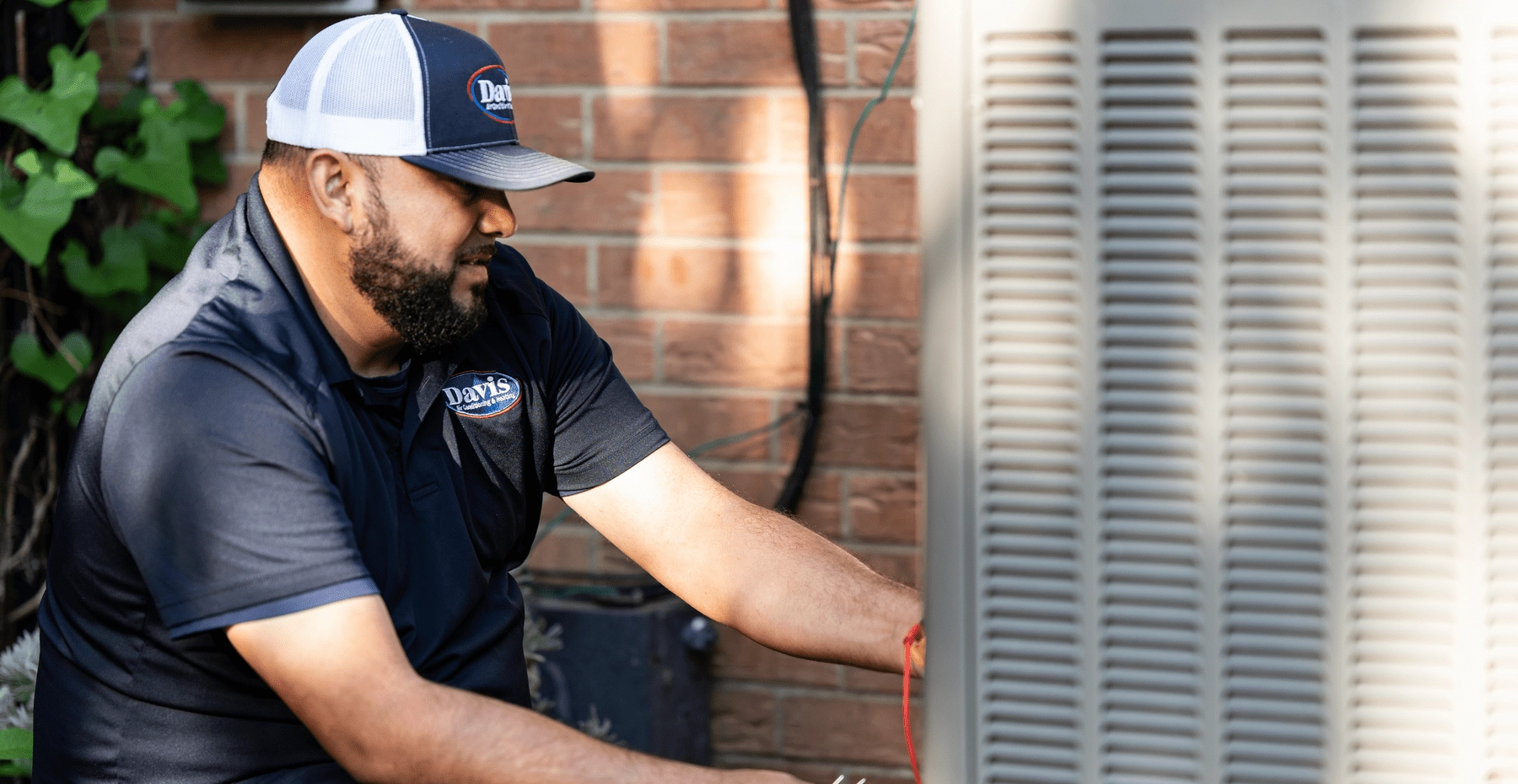 Service technician adjusting carrier unit