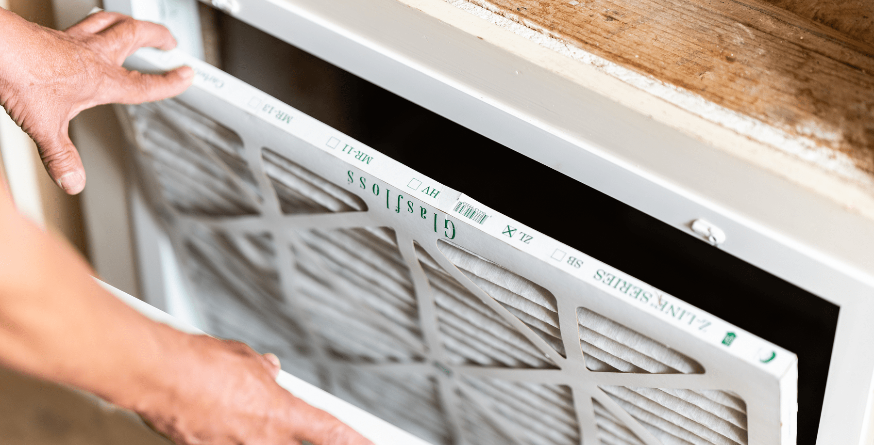 Man sneezing from dusty air vents and ducts