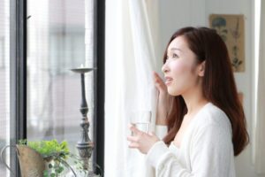 Asthma Lady Standing By The Window Shutterstock 316861313