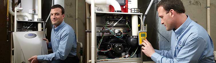 Service technician inspecting heating unit