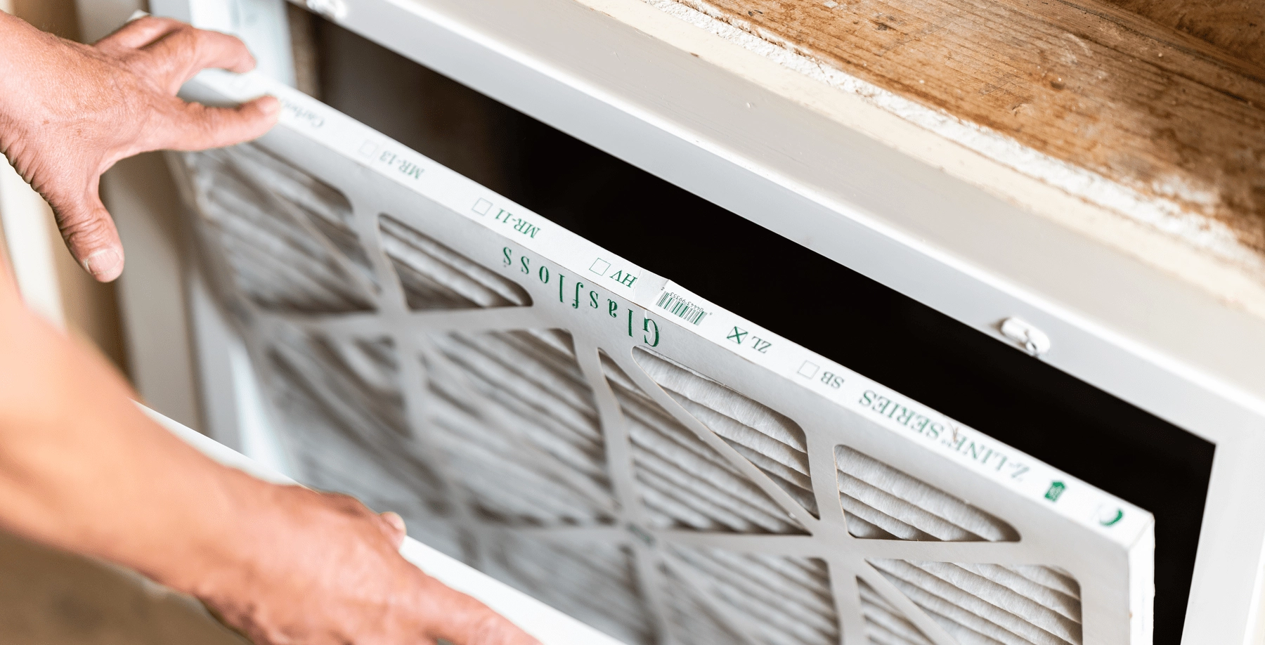 Man sneezing from dusty air vents and ducts
