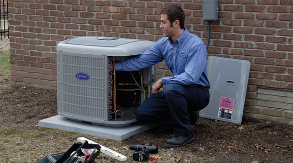 Technician working on air conditioner repair